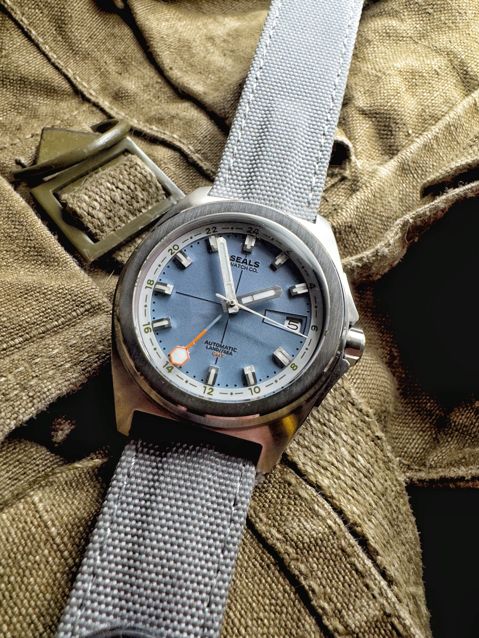 Automatic GMT Wrist Watch in Everest Blue Dial, Gray 24-Hour Ring With Green Accents and Orange Tipped GMT Hand