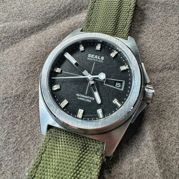 Land // Sea 3-Hand Automatic Watch with Black Dial, White Accents with Date-Reveal and Granulated Texture